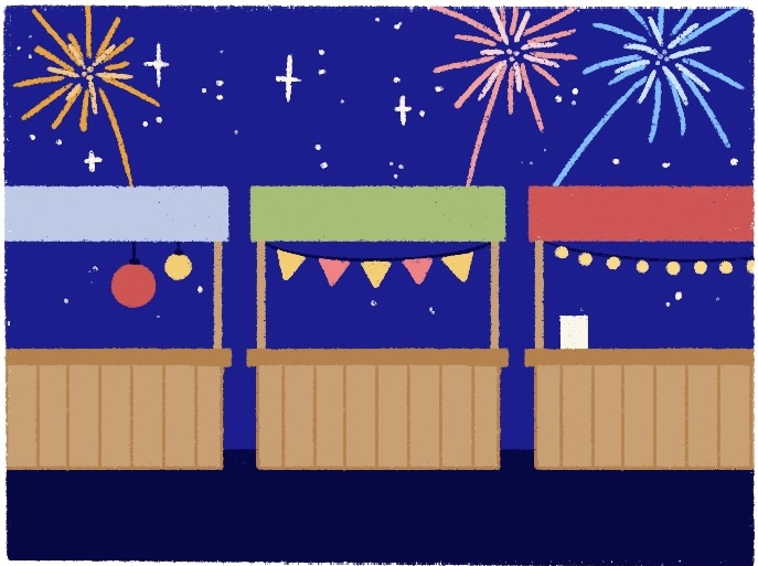 booths with decorative banners in night scenery with fireworks