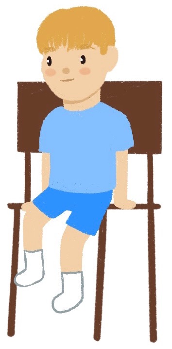 small boy sitting in a chair
